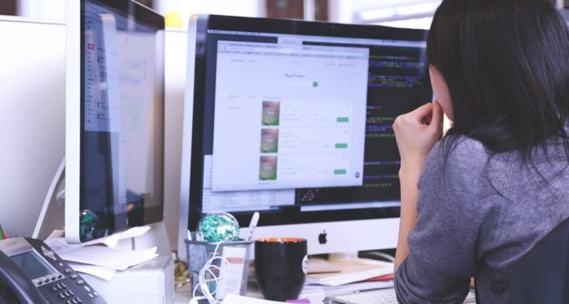 women looking at pc women looking at pc