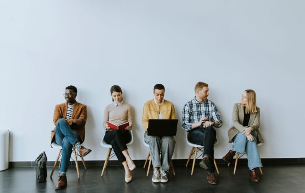 group-bored-young-people-waiting-job-interview
